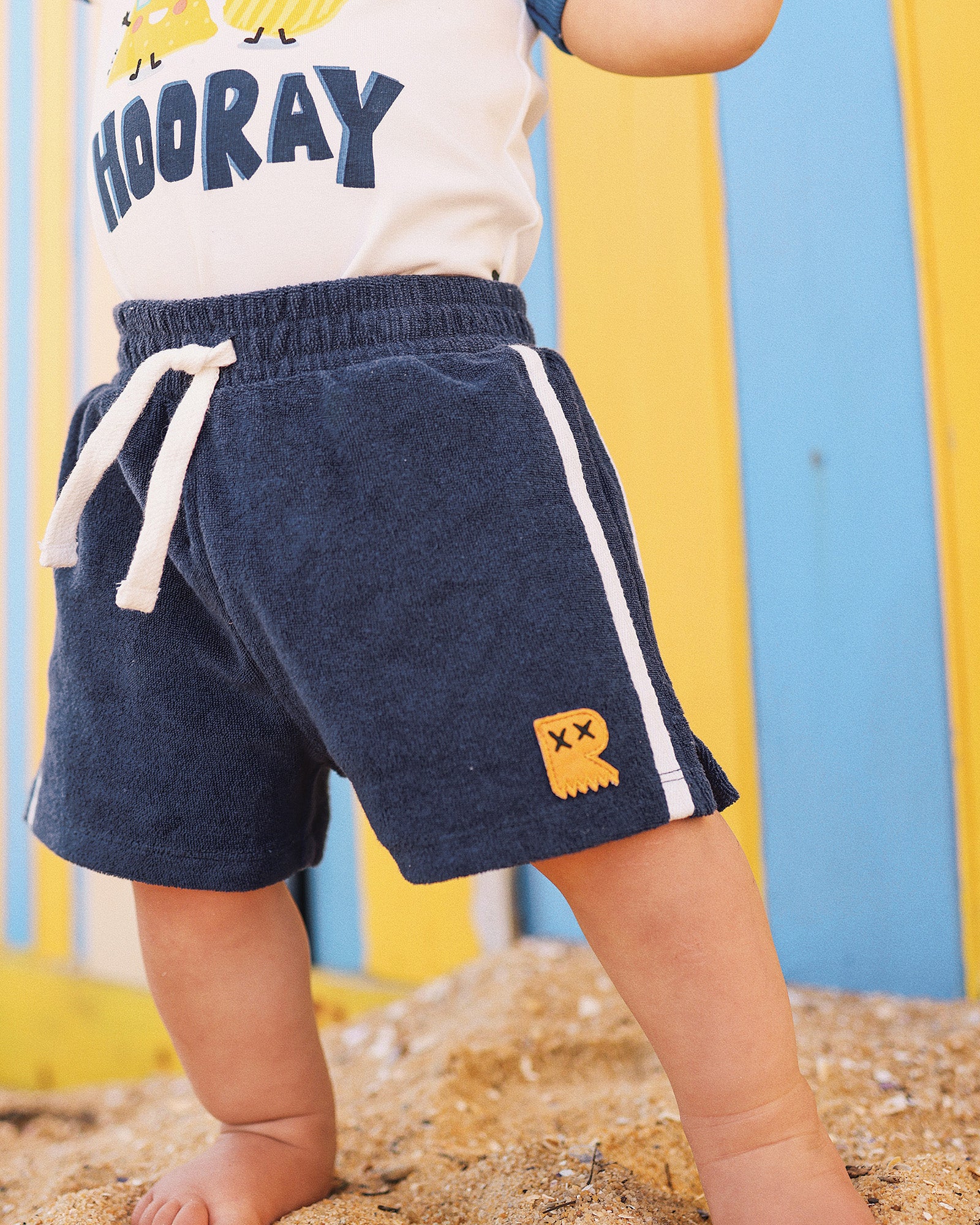 DINO DASH BABY TERRY SHORTS IN NAVY