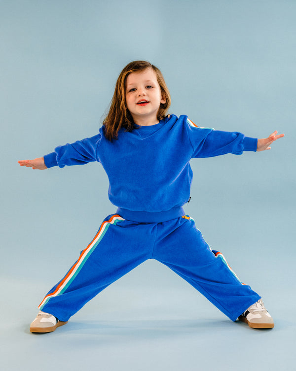 COSMIC POWERS TERRY TRACK PANTS IN NAVY