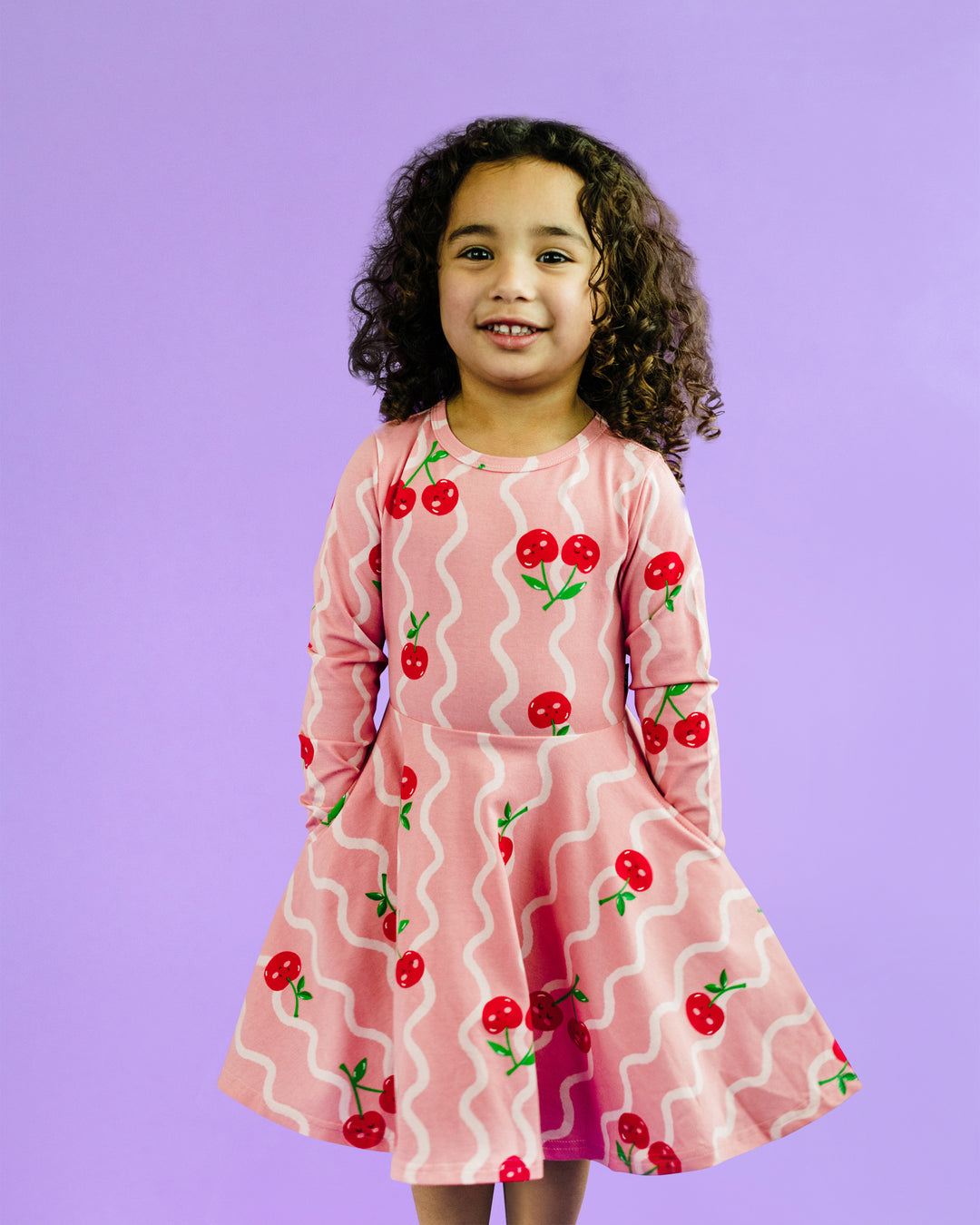 CHERRY SQUIGGLE WAISTED LONG SLEEVE DRESS