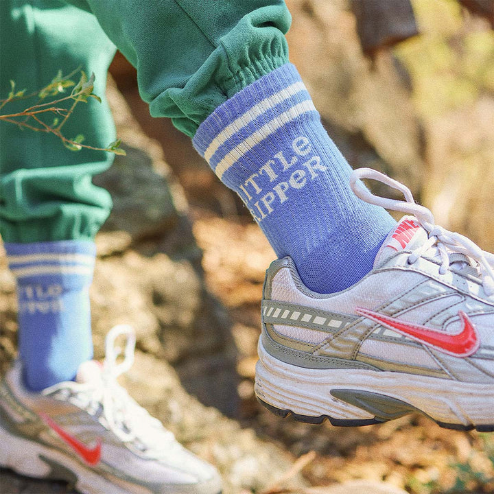 Child wearing the blue Little Ripper kids crew socks