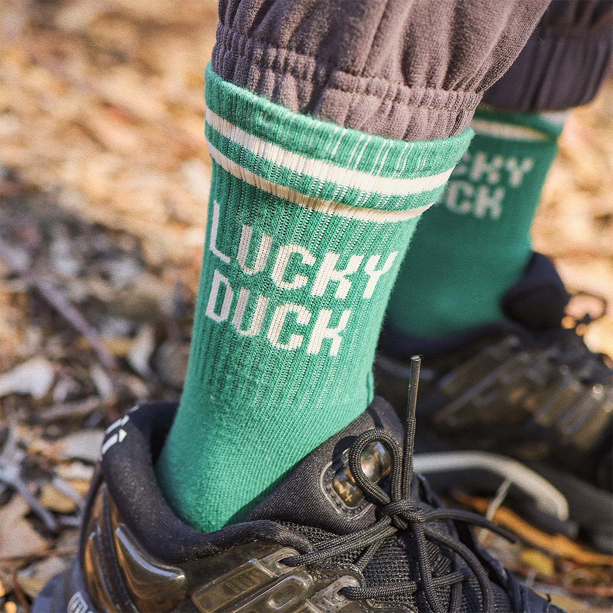Close up of the Lucky Duck print on the green kids socks