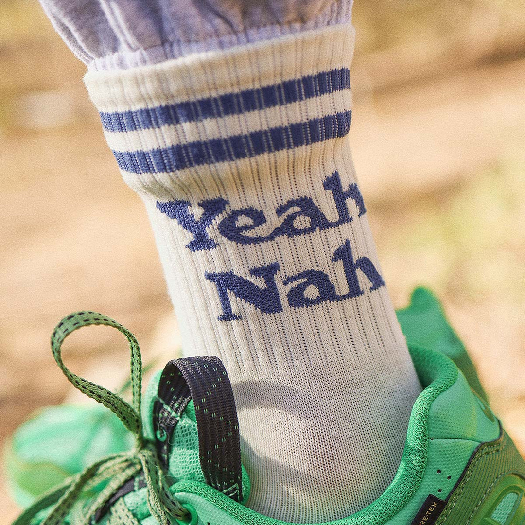 Kids Yeah Nah socks in white with blue lettering