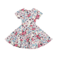 A girl's UNICORN LULLABY WAISTED DRESS from Rock your Baby Online on a black background.