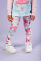 A little girl wearing Rock your Baby Online's BALLET BALLOONS TIGHTS in pink and white flamingo leggings.
