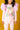 a little girl wearing a Rock your Baby Online Kitty Kat T-Shirt and pink pants.