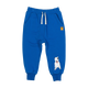 A PATCH TRACK PANTS from Rock your Baby Online blue jogging pant with a white dog on it.